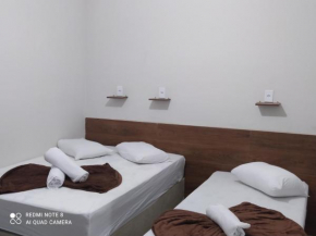 Pousada Quarto com ventilador,ar frigobar e garagem